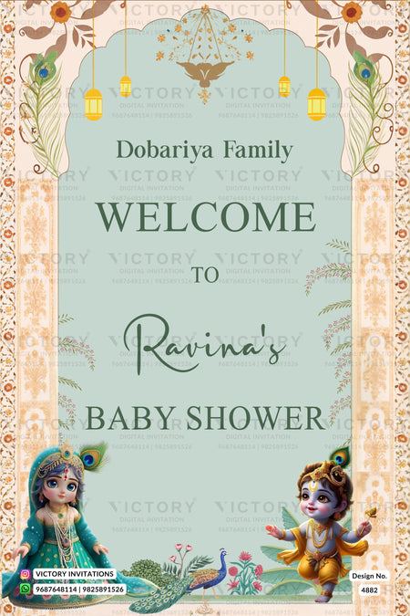 A festive baby shower invitation card design with a light teal center panel, ornate beige floral borders, hanging lanterns, peacock motifs, and cartoon illustrations of a woman in teal and a child in gold. The text reads 'Dobariya Family Welcome to Ravina's Baby Shower' with 'Victory Invitations' watermarked across the design.