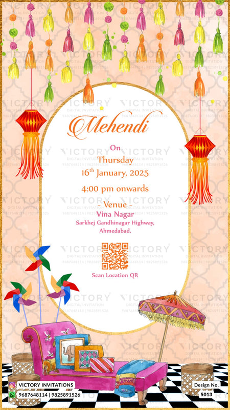 A festive Mehndi event invitation card featuring a cream central oval with event details, surrounded by a peach patterned background decorated with hanging tassels, red lanterns, colorful pinwheels, a pink sofa, and a patterned umbrella. Watermark text for Victory Invitations is visible.