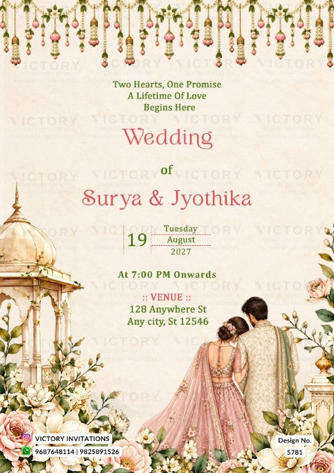 A wedding invitation card featuring an elegant Indian theme with a cream background, pink and red text, hanging floral garlands at the top, a domed temple illustration on the left, and a couple in traditional wedding attire on the bottom right. The brand name 'Victory Invitations' is watermarked across the card.