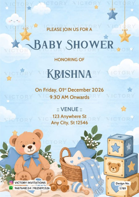 A baby shower invitation card with a light blue sky and clouds background, featuring a teddy bear, a basket, a blue blanket, and stacked toy blocks. The text reads 'Please join us for a Baby Shower honoring of Krishna On Friday, 01st December 2026 9:30 AM Onwards' with venue details below.